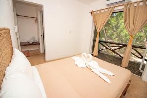 Postel nebo postele na pokoji v ubytování Hotel Ak'Na Holbox