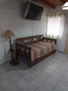 Ένα ή περισσότερα κρεβάτια σε δωμάτιο στο Complejo los Andes II con estacionamiento