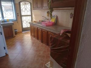 a kitchen with a sink and a counter top at location vacance sidi bouzid in Sidi Bouzid