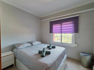 a bedroom with a large bed with a window at Family apartment Besos in Barcelona