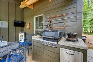 a outdoor kitchen with a stove and a grill at Charming Eclectic Vacation Rental with Beach Access! in Eclectic