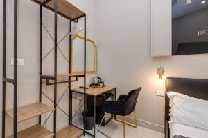 A bed or beds in a room at Empire Suites