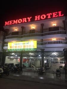 a monday hotel with motorcycles parked outside at night at Vientiane Memory Hotel in Vientiane