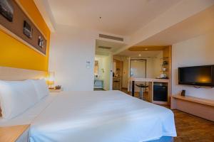 Krevet ili kreveti u jedinici u okviru objekta Hotel Leisure Tamsui