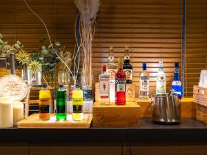 a counter with different types of bottles of alcohol at Super Hotel Premier Akasaka in Tokyo