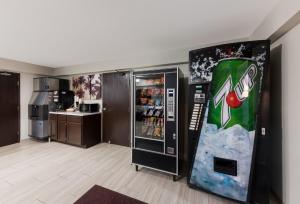 a soda machine in a kitchen with a refrigerator at Red Roof Inn Mansfield in Mansfield