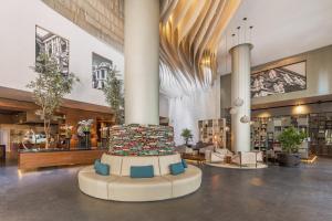 a large lobby with a large cake in the middle at Live Aqua Ciudad de Mexico Bosques de las Lomas in Mexico City
