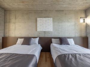 Un pat sau paturi într-o cameră la K-Style-Resort-SEVEN Hotels and Resorts- +62 fotografii