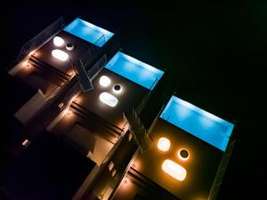 ein Gebäude mit Lichtern in der Nacht in der Unterkunft K-Style-Resort-SEVEN Hotels and Resorts- in Nakijin
