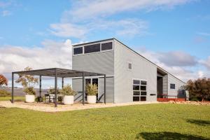 a modern house with a metal roof at Breakneck Gorge Akora in Hepburn Springs