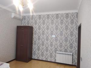 a room with a wall with a patterned wall at Elchins villa in Gabala