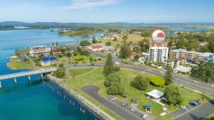 an aerial view of a city next to the water at Mirage Unit 101 in Tuncurry