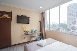Postel nebo postele na pokoji v ubytování Hotel 28 Titiwangsa