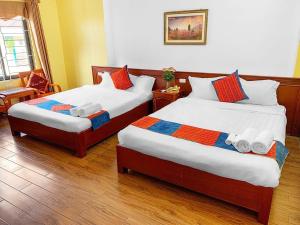 Postel nebo postele na pokoji v ubytování Cherry Hotel