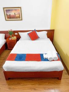 Postel nebo postele na pokoji v ubytování Cherry Hotel