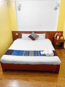 Postel nebo postele na pokoji v ubytování Cherry Hotel