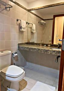 Et badeværelse på Flat aconchegante 5 andar