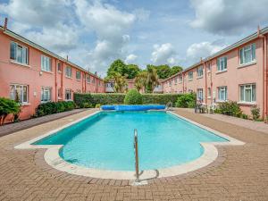 a swimming pool in the middle of a building at First Floor Apartment - Uk44652 in Paignton