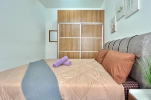 Katil atau katil-katil dalam bilik di 2BR Alanis Suite With Balcony +22 gambar