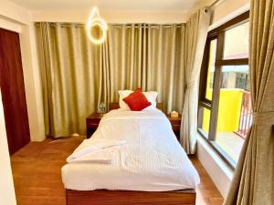 Tempat tidur dalam kamar di Hotel Pala
