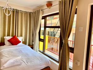 Tempat tidur dalam kamar di Hotel Pala