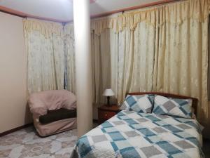 Giường trong phòng chung tại Hostal Amazónico Bello Amanecer