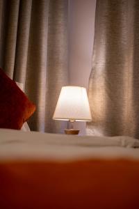 Tempat tidur dalam kamar di Hotel Pala