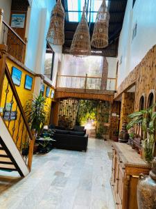 a large lobby with a couch and a staircase at Nirvana Beach Resort in Boracay