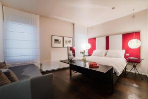 Säng eller sängar i ett rum på Hotel Casa Poli