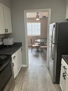 A kitchen or kitchenette at Walk to AT&T Stadium! Free parking on Premises