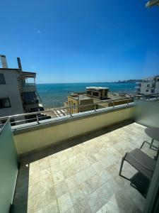 a balcony with a view of the ocean at Split Rooftop Suites in Durrës
