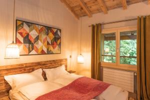 A bed or beds in a room at Le Wafo