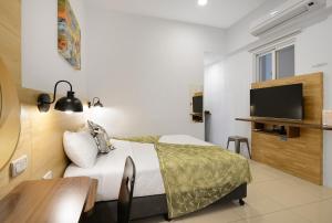 Uma televisão e/ou sistema de entretenimento em 康逸旅宿Comeinn2