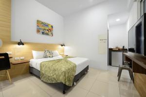 Uma televisão e/ou sistema de entretenimento em 康逸旅宿Comeinn2