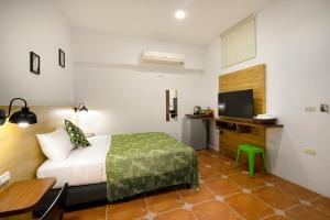 Uma cama ou camas num quarto em 康逸旅宿Comeinn2
