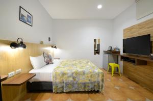 Uma cama ou camas num quarto em 康逸旅宿Comeinn2