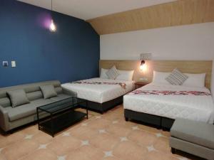 Uma cama ou camas num quarto em 康逸旅宿Comeinn2