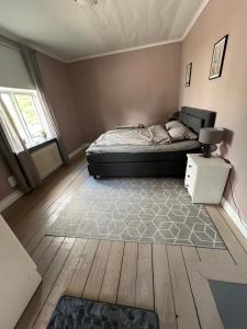 a bedroom with a bed and a rug at 1 bedroom apartment, whole flat in Arvika