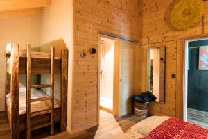 A bed or beds in a room at Le Wafo