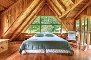 Postel nebo postele na pokoji v ubytování La Providencia Lodge