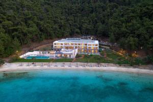 an aerial view of a hotel on the beach at Vathi Cove Luxury Resort & Spa in Chrysi Ammoudia