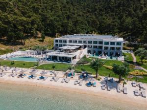 an aerial view of a hotel on the beach at Vathi Cove Luxury Resort & Spa in Chrysi Ammoudia