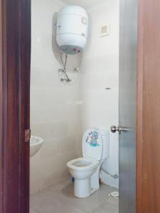 a bathroom with a toilet and a sink at Prime chalet in Golf Porto Marina resort new Alamein in El Alamein