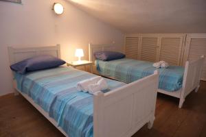 En eller flere senge i et værelse på Casa Bianchi - Villa immersa nel verde