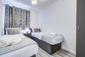 Katil atau katil-katil dalam bilik di Spacious Urban Apartment in Croydon +14 gambar
