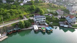 an aerial view of a house on the water at Apartment Hara, luxury lakeside suite with exquisite view in Jablanica