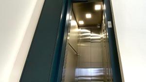 a shower in a bathroom with a mirror at AVA Flats in Alicante