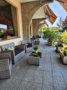 a patio with couches and tables on a building at Hotel Route 9 in Cadeo