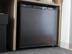 a metal garage door in a book shelf at Super Hotel Akihabara Suehirocho in Tokyo