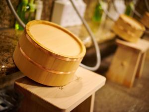 a wooden bucket sitting on top of a table at Super Hotel Akihabara Suehirocho in Tokyo